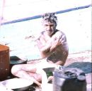 Sailor bathing on Dhow, Dubai Creek
